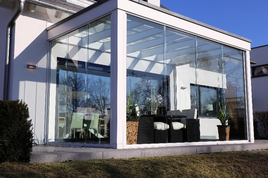 Exterior of a glass enclosed patio with solar control window film.