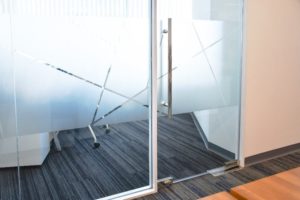 An image of a partial privacy window film covering the inside of a building’s conference room.