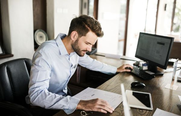 Business man at desk 1 Work from home