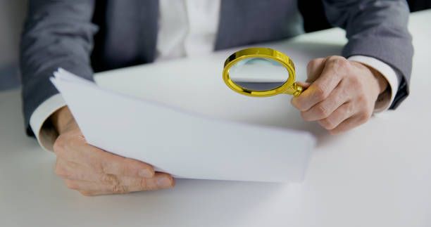 Magnifying glass with document
